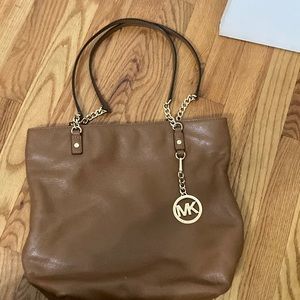 Tan Over the shoulder Michael Kors bag.